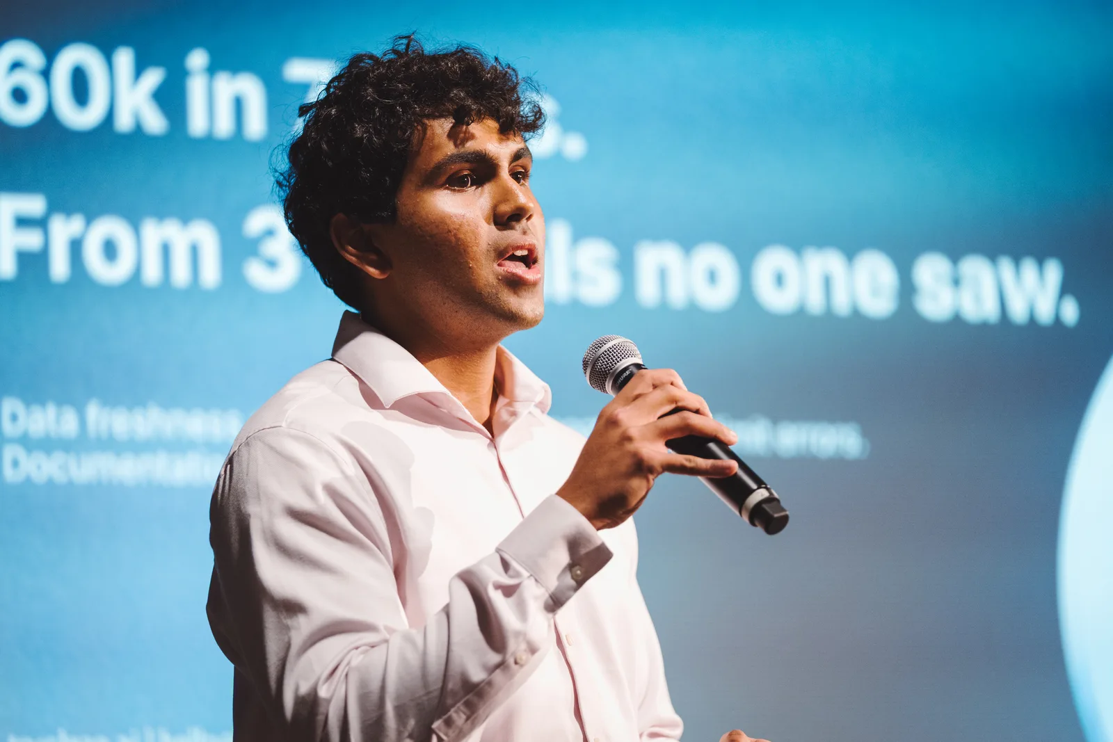 A founder sharing company results at demo day